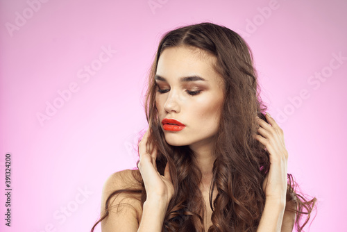 Woman with hairstyle and red lips naked shoulders bright makeup attractive look