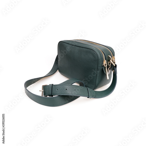 Elegant green female cross body bag isolated on white background photo