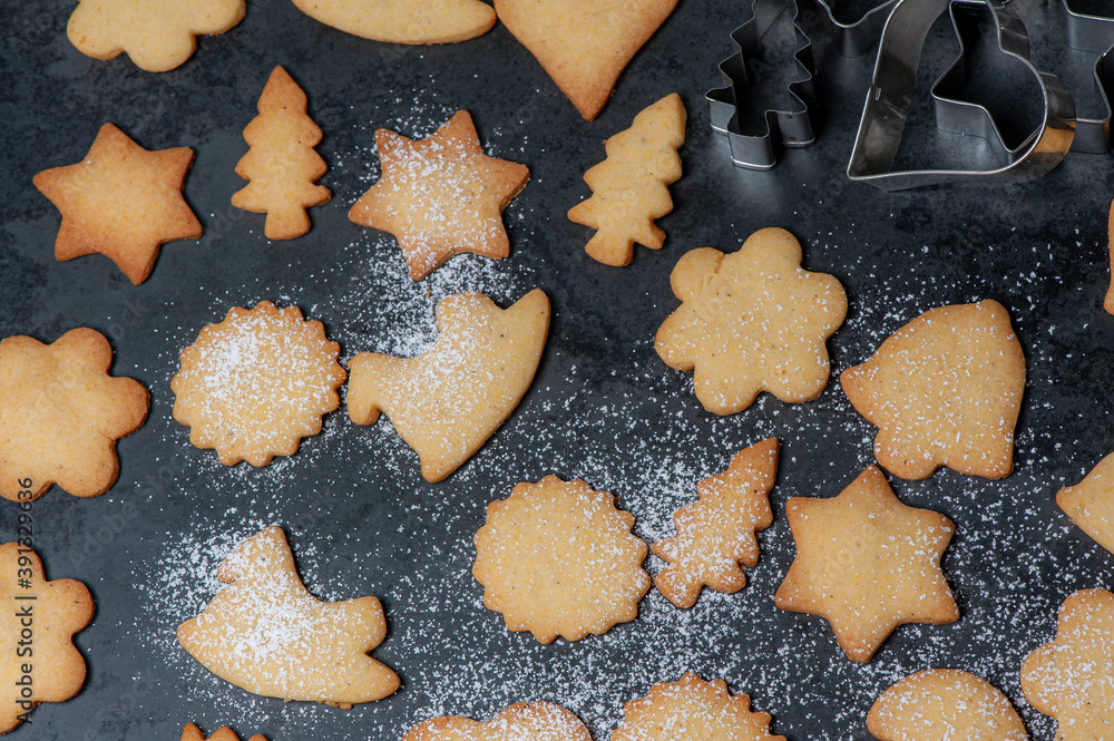 Close-up of delicious homemade Cookies, in preparation for Christmas, displayed on a Slateplate. Covered with powdered sugar. Close-up of delicious homemade Cookies, in preparation for Christmas, displayed on a Slateplate. Covered with powdered sugar.