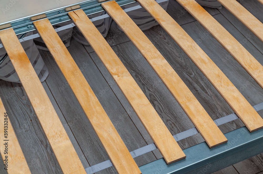 Obraz premium birch slats on the metal frame of the bed