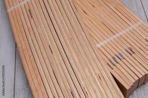 unpacked packaging of birch slats on the floor