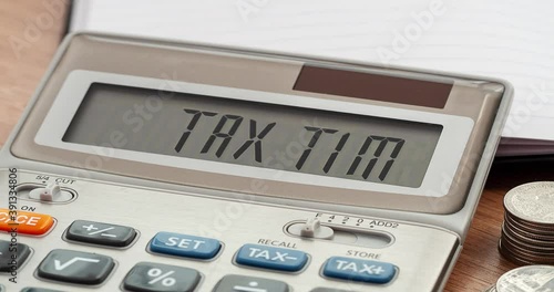 Tax Time word on calculator. Business and tax concept. Time to pay tax in year.