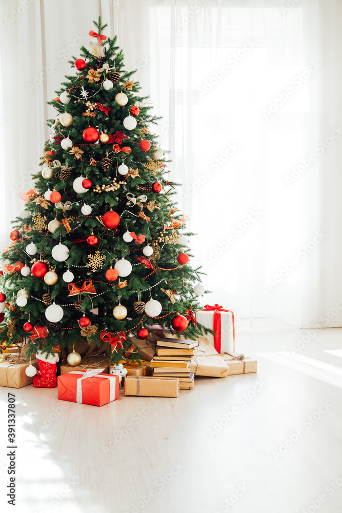 Christmas tree by the window interior of the room New Year holiday gifts Christmas tree by the window interior of the room New Year holiday gifts