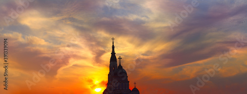  image of a Christian temple on a sunset background