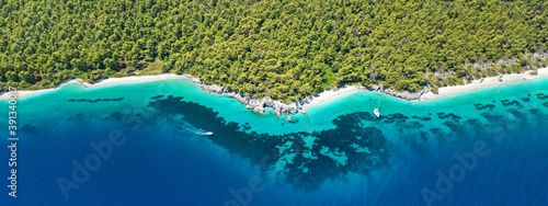Aerial ultra wide panoramic view of tropical paradise rocky bay visited by sailboats and yachts in Caribbean exotic destination island © aerial-drone
