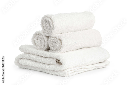 several white beach cotton towels folded on white background