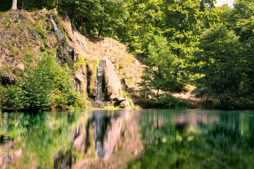 Luisenthaler Waterfall of Thuringia at small lake, long exposure