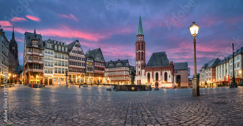 Frankfurt, Germany. Panorama of Romerberg - historic market square with german timber houses at dusk photo