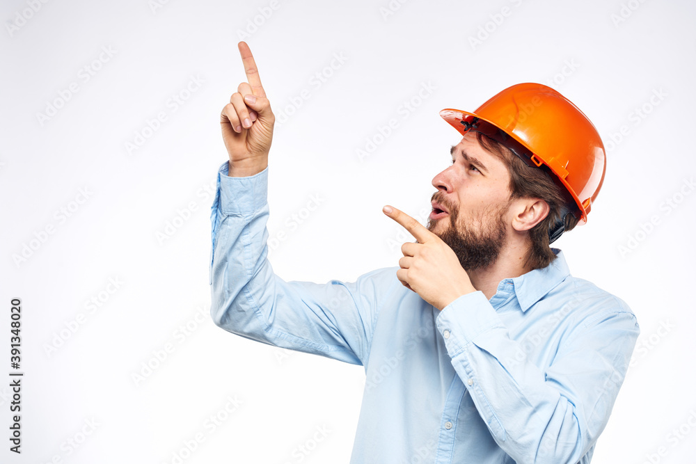 Man in shirt orange helmet safety emotions construction professional cropped view