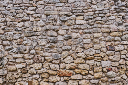 Texture of a very ancient stone wall