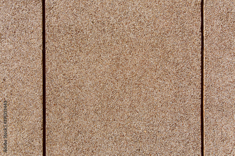 Fototapeta premium wall texture with a granular coating of moisture resistant tar, a close-up of a building facade with copy space, nobody.
