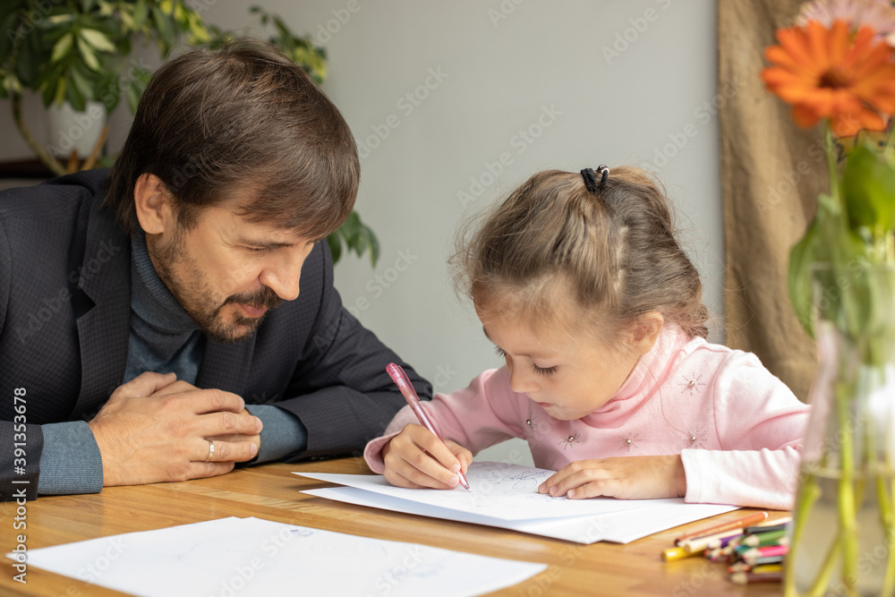 Young girl doing homework during extra-curricular classes with a tutor Young girl doing homework during extra-curricular classes with a tutor