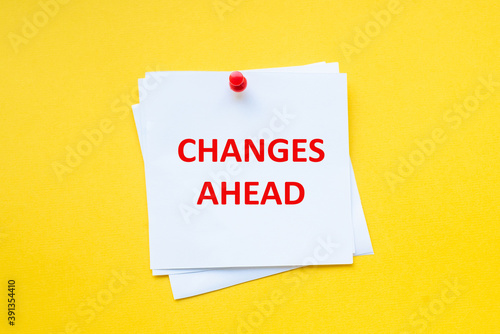 Changes ahead. Motivational slogan on white sticker with yellow background