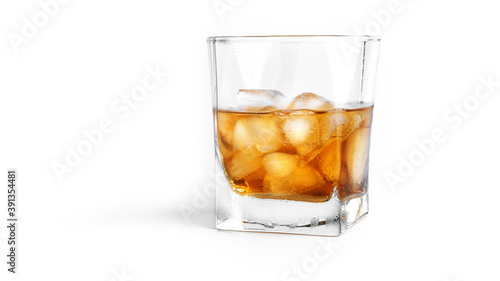 Whiskey with ice on white background. . High quality photo