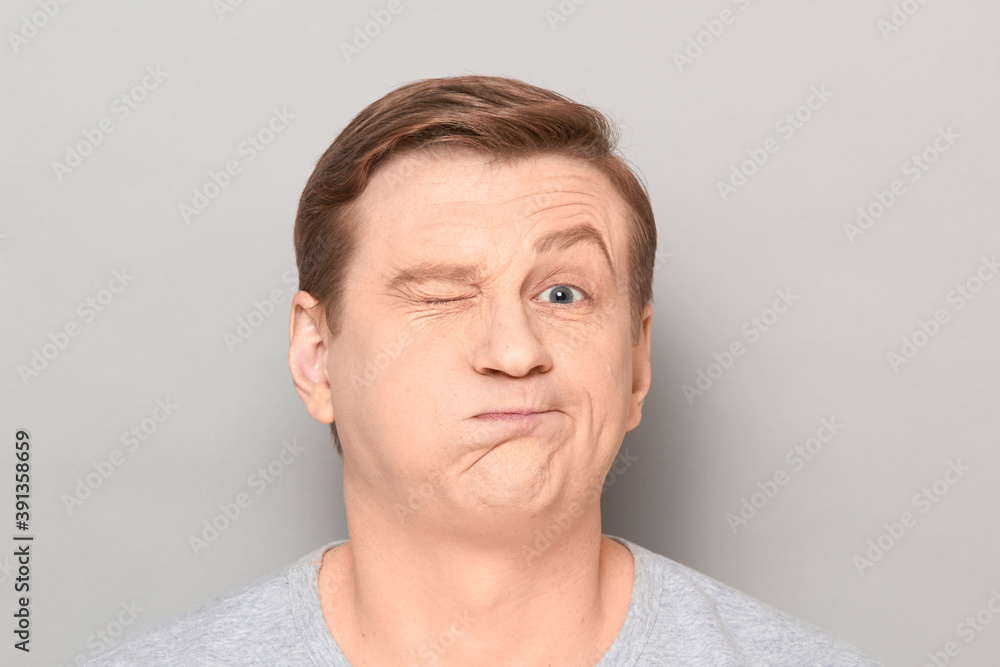 Portrait of funny man grimacing and making goofy crazy face Portrait of funny man grimacing and making goofy crazy face