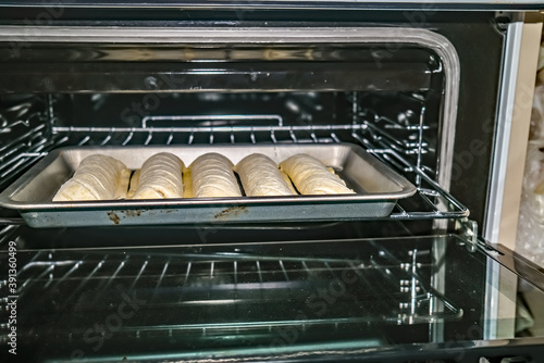 Norwich, Norfolk, UK – November 06 2020. Illustrative editorial image of frozen sausage rolls, made by Greggs, on a baking tray ready for cooking in the top oven photo