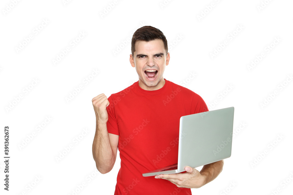 Young emotional man with computer laptop on white background Young emotional man with computer laptop on white background