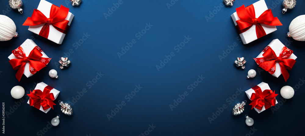 Merry Christmas and Happy Holidays greeting card, frame, banner. New Year. Noel. Christmas ornaments and gift box on blue background top view. Winter xmas holiday theme. Flat lay
Merry Christmas and Happy Holidays greeting card, frame, banner. New Year. Noel. Christmas ornaments and gift box on blue background top view. Winter xmas holiday theme. Flat lay