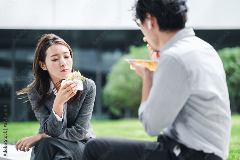 Businessman And Businesswoman Eating Lunch Together Businessman And Businesswoman Eating Lunch Together
