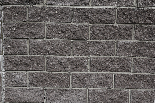 the texture of a concrete gray wall blocks like brick