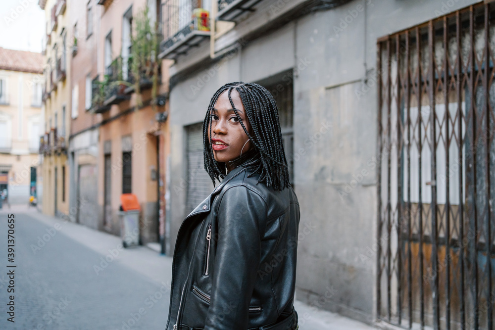 Stylish Afro Woman On The Streets Of Madrid Old Town. Stylish Afro Woman On The Streets Of Madrid Old Town.