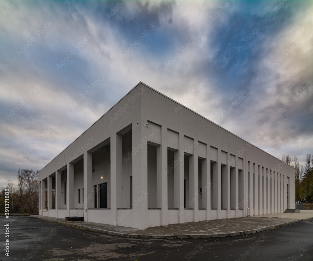 Fototapeta premium Modern сrematorium building under the blue sky