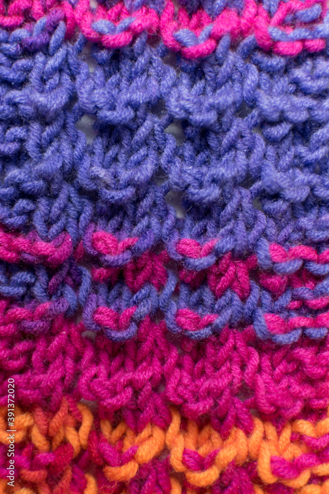 hand knitted wool texture in pink and purple 