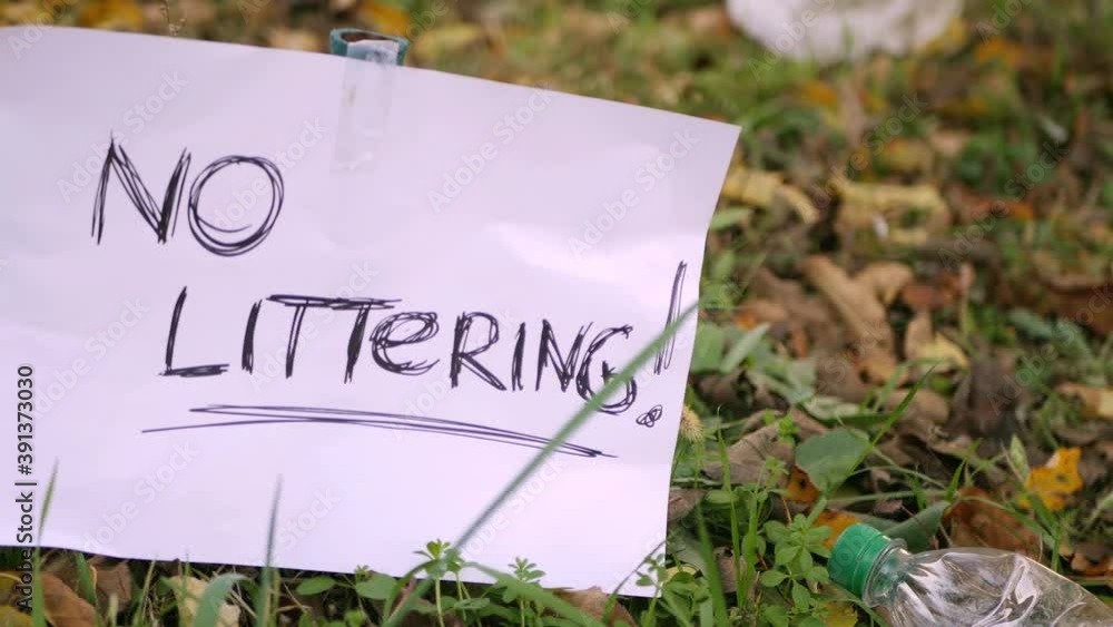 No littering sign in the park. Throw away plastic bottle outdoor. 4k