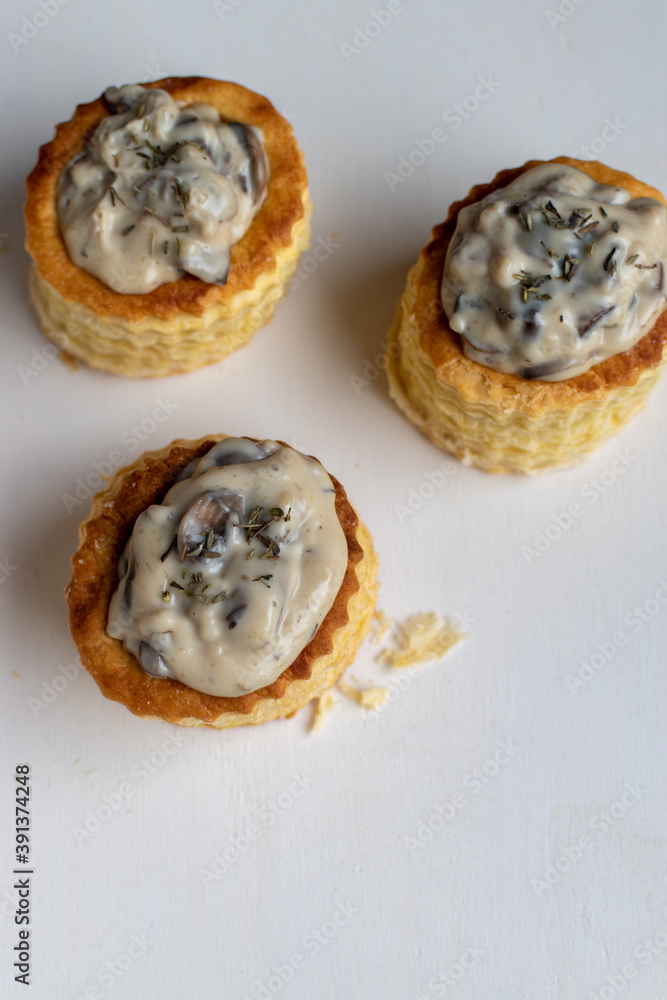three mushroom vol au vents on a white background three mushroom vol au vents on a white background