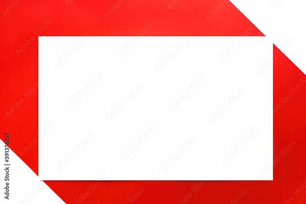 Blank white card on red background. Symmetric composition. Top view, empty space for text. Blank white card on red background. Symmetric composition. Top view, empty space for text.