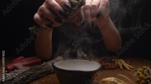 extreme close-up, detailed. hands of a witch with black nails above a bowl of thick white smoke.