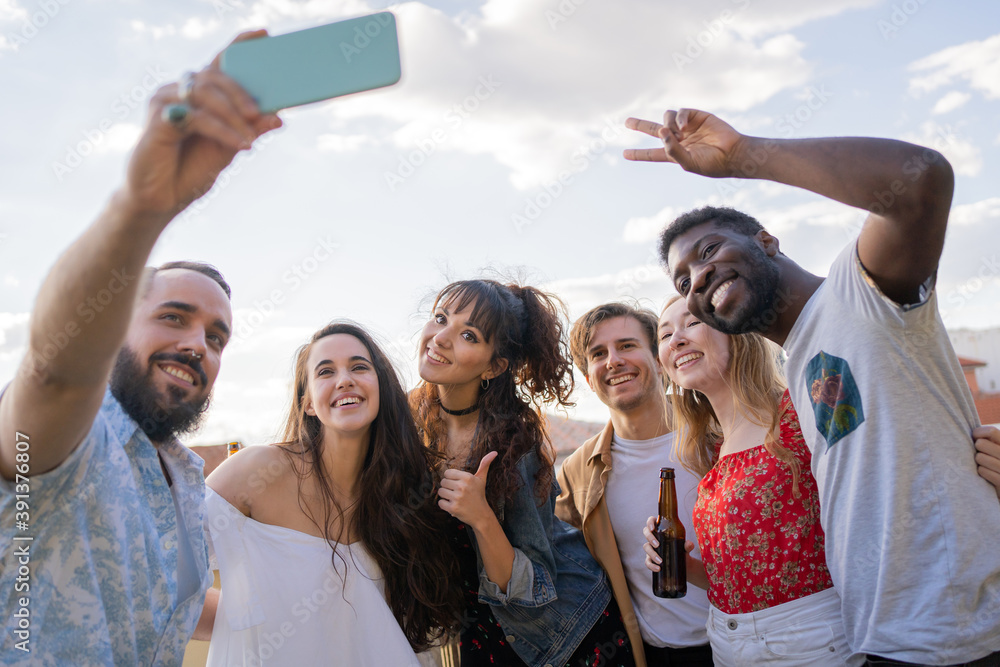 Multiracial Group Of People Taking A Selfie Outdoors. Multiracial Group Of People Taking A Selfie Outdoors.