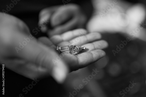 hand holding cufflinks