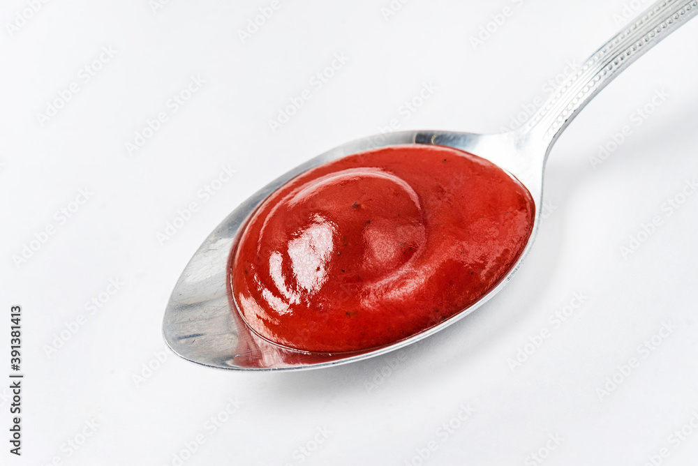 ketchup on the spoon isolated ketchup on the spoon isolated