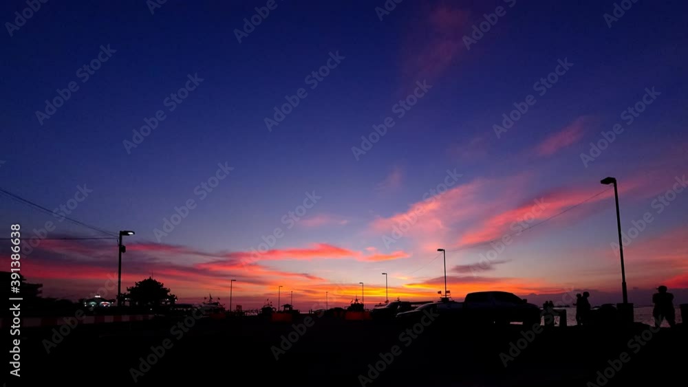 Time lapse of dramatic twilight sky with silhouette traffic on port, Siracha city, Chonburi, Thailand Time lapse of dramatic twilight sky with silhouette traffic on port, Siracha city, Chonburi, Thailand