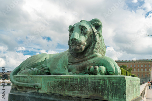 lion bronze statue on norrbro bridge in Stockholm by the Swedish parli photo