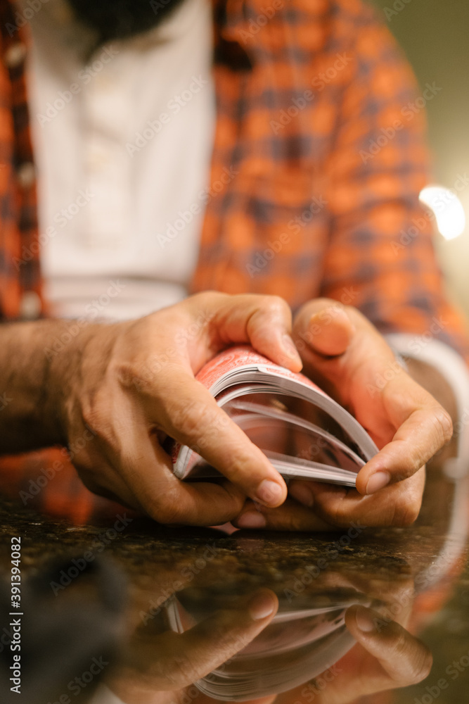 Black male hands shuffling and dealing playing cards Black male hands shuffling and dealing playing cards