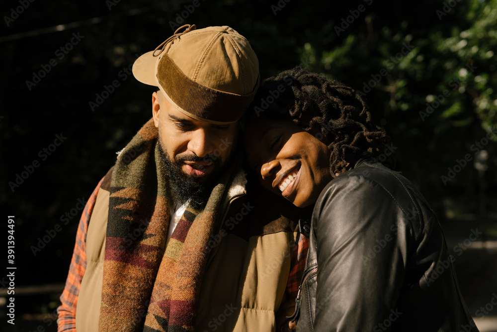 African American couple walking in neighborhood African American couple walking in neighborhood