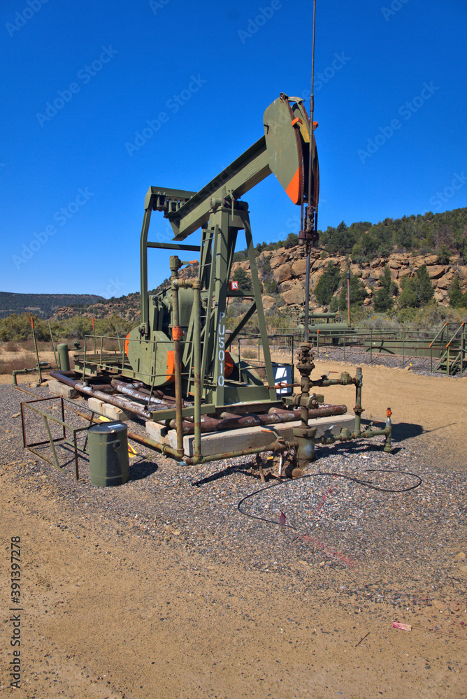 Oil pump painted to match the surrounding landscape 