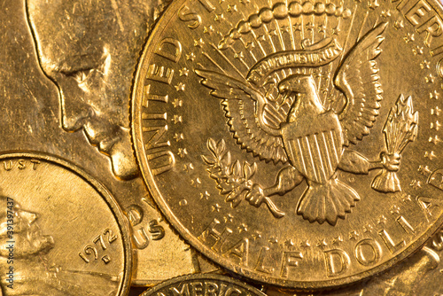 Stack of american gold coins background. US half Dollar coin with eagle. Concept of a stable banking system and economy.