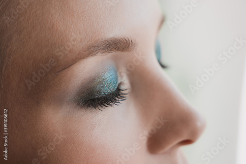Fototapeta Naklejka Na Ścianę i Meble -  closed eyes of a girl close up