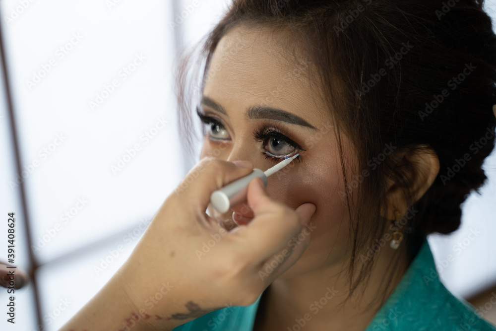 Close up woman have a makeup service by makeup artist Close up woman have a makeup service by makeup artist