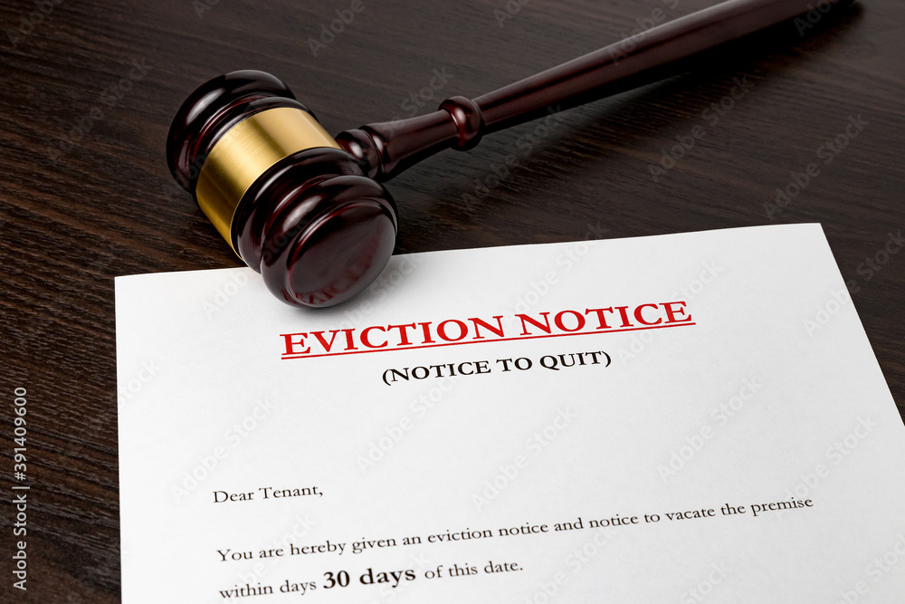 Eviction notice document with gavel. Concept of financial hardship, housing crisis and mortgage payment default.