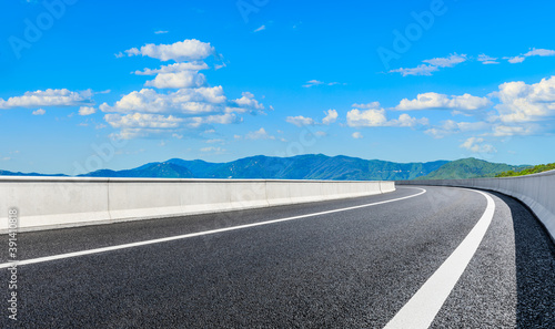 New asphalt road and green mountain with sky cloud natural landscape. © ABCDstock