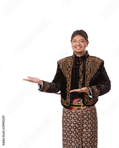 A portrait of a costume traditional Javanese man. Showing copy space isolated on white background photo