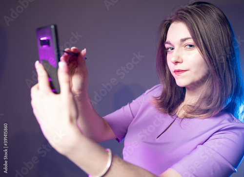Girl with a smartphone. The...