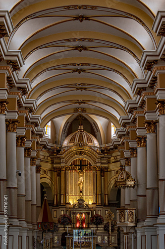 A picture of the interior art of a church with large colons and ornaments. Photo taken with tripod.