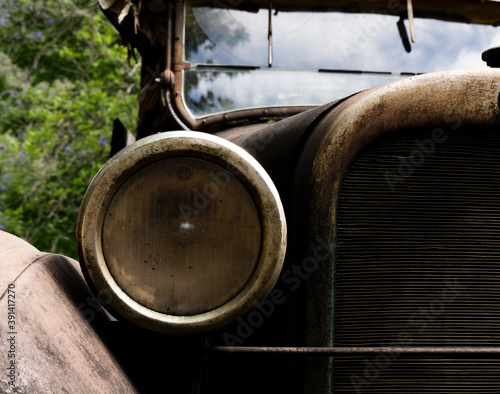 Fotografie detail of rusted headlight on vintage ute.
