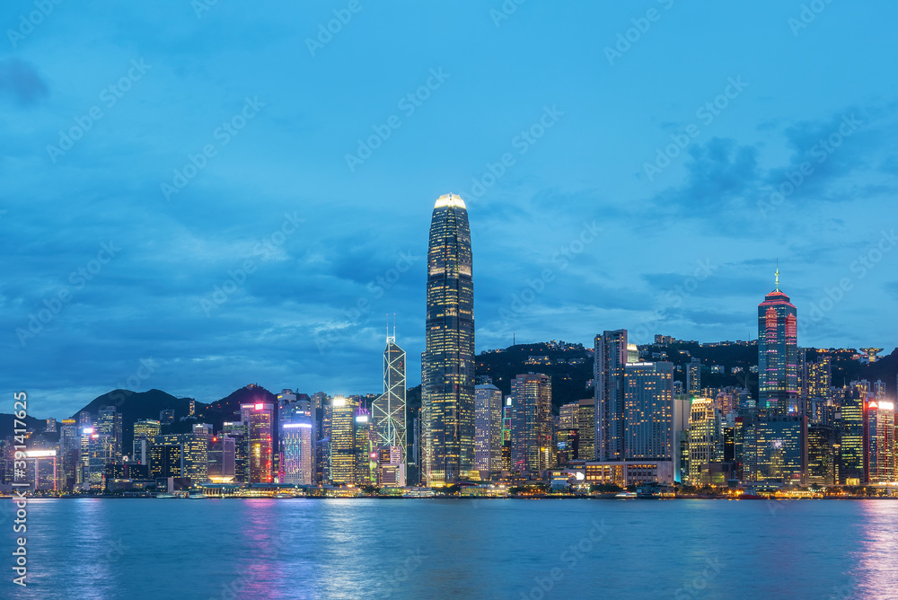 Panorama of Victoria harbor of Hong Kong city at dusk