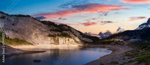 Beautiful Panoramic View of Og Lake in the Iconic Mt Assiniboine Provincial Park near Banff, Alberta, Canada. Canadian Mountain Landscape Background Panorama. Vibrant Colorful Sunset Sky